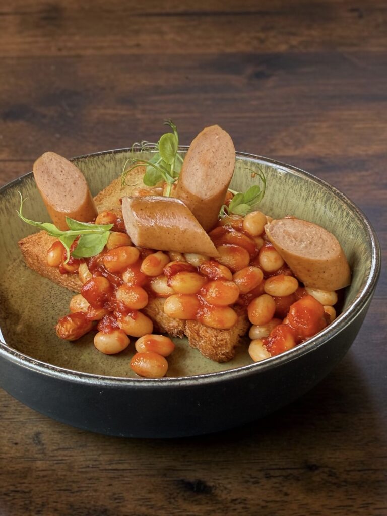 Baked beans on toast and sausage